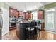 Well-equipped kitchen features cherry cabinets, stainless appliances, and a functional center island at 50 Cannonade Ct, Covington, GA 30016
