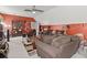 Open-concept living room with comfortable sofas, coffee table, and hardwood flooring at 50 Cannonade Ct, Covington, GA 30016