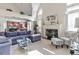 Inviting living room featuring vaulted ceilings, fireplace, and an open floorplan to the kitchen at 50 Cannonade Ct, Covington, GA 30016