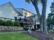 Home's exterior showing a multi-level deck, mature trees, and a well-maintained lawn at 77 Russell Rd, Lawrenceville, GA 30043