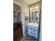 Charming bathroom with a sliding barn door vanity and rustic wood accents at 77 Russell Rd, Lawrenceville, GA 30043