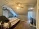 Bedroom featuring sloped ceilings, carpeted floors, ceiling fan, and a cozy window seat at 77 Russell Rd, Lawrenceville, GA 30043