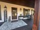 Charming front porch with welcome sign, rocking chair, and rustic decor at 77 Russell Rd, Lawrenceville, GA 30043
