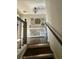 Upstairs landing with hardwood floors, decorative accents, and white wainscoting on ceiling at 77 Russell Rd, Lawrenceville, GA 30043