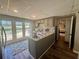 Cozy kitchen with stainless steel appliances, gray cabinets, and double glass doors to the backyard at 77 Russell Rd, Lawrenceville, GA 30043