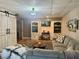 Cozy living area with bookshelves, large sofa, and decorative lighting at 77 Russell Rd, Lawrenceville, GA 30043