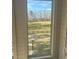Window view of large backyard with black fencing and a shed behind the property at 77 Russell Rd, Lawrenceville, GA 30043