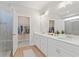 Modern bathroom with double sinks, walk-in shower with glass door, and a walk-in closet at 18 Torry Pines Cir, Villa Rica, GA 30180