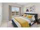 Comfortable bedroom with a large window providing natural light and view of the landscape at 18 Torry Pines Cir, Villa Rica, GA 30180