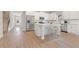 Bright kitchen features white cabinetry, stainless steel appliances, and a center island with seating at 18 Torry Pines Cir, Villa Rica, GA 30180