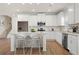 Contemporary kitchen with white cabinets, stainless steel appliances, and a center island with barstool seating at 18 Torry Pines Cir, Villa Rica, GA 30180