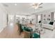 Open-concept living area with hardwood floors, comfortable seating, and a view of the modern kitchen at 18 Torry Pines Cir, Villa Rica, GA 30180