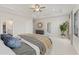 Large main bedroom featuring a tray ceiling, plush carpeting, and an ensuite bathroom entrance at 18 Torry Pines Cir, Villa Rica, GA 30180