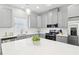 Modern kitchen with stainless steel appliances, grey cabinets, white countertops and tile backsplash at 340 Old Sudie Rd, Hiram, GA 30141