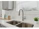 Contemporary kitchen sink with white quartz countertop and stylish faucet fixtures at 340 Old Sudie Rd, Hiram, GA 30141