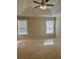 Bedroom featuring a tray ceiling with ceiling fan, and natural light at 4457 Webb Meadows Dr, Loganville, GA 30052
