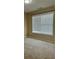 Spacious bedroom with carpet flooring and natural light from a window with blinds at 4457 Webb Meadows Dr, Loganville, GA 30052