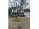 Charming two-story home with stone accents, a covered porch, and an attached garage at 4457 Webb Meadows Dr, Loganville, GA 30052