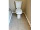 Standard white toilet against neutral walls with tile flooring at 4457 Webb Meadows Dr, Loganville, GA 30052