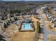 Neighborhood aerial view with a community pool, playground, and well-maintained landscaping at 6645 Country Lake Rd, Cumming, GA 30041