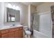 Cozy bathroom offers shower-tub combo and updated vanity with great lighting at 6645 Country Lake Rd, Cumming, GA 30041