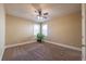 Inviting bedroom featuring neutral tones, natural light and a ceiling fan at 6645 Country Lake Rd, Cumming, GA 30041