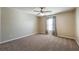 Well-lit bedroom featuring a ceiling fan, neutral walls, and natural light at 6645 Country Lake Rd, Cumming, GA 30041