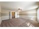 Bonus room with neutral walls, ceiling fan, carpeted flooring and natural light at 6645 Country Lake Rd, Cumming, GA 30041