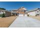 Charming two-story brick home featuring a two-car garage and inviting front yard at 6645 Country Lake Rd, Cumming, GA 30041