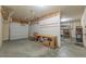 Spacious garage with workbench and shelving for organized storage solutions at 6645 Country Lake Rd, Cumming, GA 30041