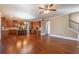 Open-concept living room showcasing a modern kitchen, hardwood floors, and ample space, perfect for modern living at 6645 Country Lake Rd, Cumming, GA 30041