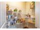 Walk-in pantry features ample shelving for organized food storage in kitchen at 6645 Country Lake Rd, Cumming, GA 30041