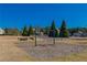 A fun playground area with swings and mature trees, perfect for outdoor activities at 6645 Country Lake Rd, Cumming, GA 30041