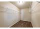 A carpeted walk-in closet with white wire shelving and neutral paint at 6645 Country Lake Rd, Cumming, GA 30041