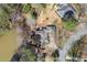 An aerial view showing the house, surrounding landscape and proximity to the water at 3093 Brookshire Way, Duluth, GA 30096