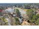 Areal image showcases the property's private lake access and lush surrounding landscape at 3093 Brookshire Way, Duluth, GA 30096