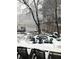 Scenic backyard features a firepit with snow covered chairs near the lake at 3093 Brookshire Way, Duluth, GA 30096