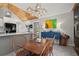 Kitchen eating area, including wooden table and chairs and a large blue cabinet, with an open floor plan at 3093 Brookshire Way, Duluth, GA 30096