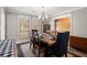Bright dining room features a wood table, upholstered chairs, and large windows at 3093 Brookshire Way, Duluth, GA 30096