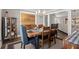 The dining room offers a wooden table with blue upholstered chairs and a cabinet at 3093 Brookshire Way, Duluth, GA 30096