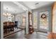 Stylish entryway with slate floors, wood accents, and views into the dining area at 3093 Brookshire Way, Duluth, GA 30096