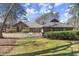 Charming single-story home with well-maintained landscaping, large driveway, and classic design elements at 3093 Brookshire Way, Duluth, GA 30096