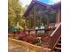 Charming home with large windows and a relaxing deck surrounded by colorful flowers at 3093 Brookshire Way, Duluth, GA 30096