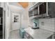 The kitchen features a microwave, a coffee maker, and a door leading outside at 3093 Brookshire Way, Duluth, GA 30096
