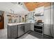 Well-lit kitchen boasts gray cabinets, stainless steel appliances, and a wood-paneled vaulted ceiling at 3093 Brookshire Way, Duluth, GA 30096