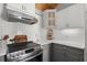 The kitchen features subway tile backsplash, a range hood, and marble countertops at 3093 Brookshire Way, Duluth, GA 30096