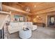 Open-concept living room with vaulted wood-paneled ceilings, mezzanine, and comfortable seating at 3093 Brookshire Way, Duluth, GA 30096
