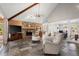 Open living room featuring a stone fireplace, high ceilings, and slate flooring at 3093 Brookshire Way, Duluth, GA 30096