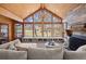 Living room with lake views from a large window, wood-paneled ceiling, and stylish fireplace at 3093 Brookshire Way, Duluth, GA 30096