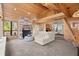 Spacious living room with wood-paneled walls, fireplace, and mezzanine with view of surrounding rooms at 3093 Brookshire Way, Duluth, GA 30096